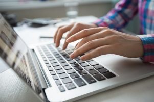 cropped-view-of-hands-typing-on-laptop_1262-3196
