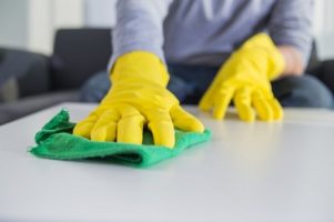 people-housework-and-housekeeping-concept-close-up-of-man-hands-cleaning-table-with-cloth-at-home_1088-1103