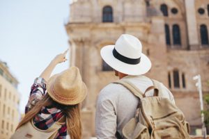 young-tourists-discovering-the-city_23-2147643246